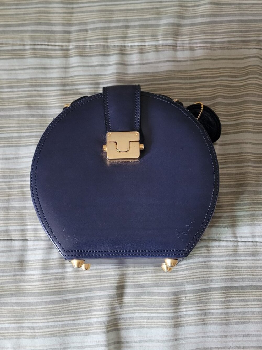 Blue handbag approximately 8 inches x 7.5 inches x 4.5 inches